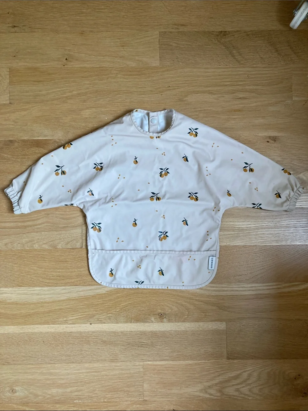 Waterproof Kids Feeding Bib Smock in Cream with Orange Print